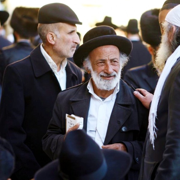 Jewish men at the Western (Wailing) Wall in Jerusalem. Jewish-Elul-Forgiveness