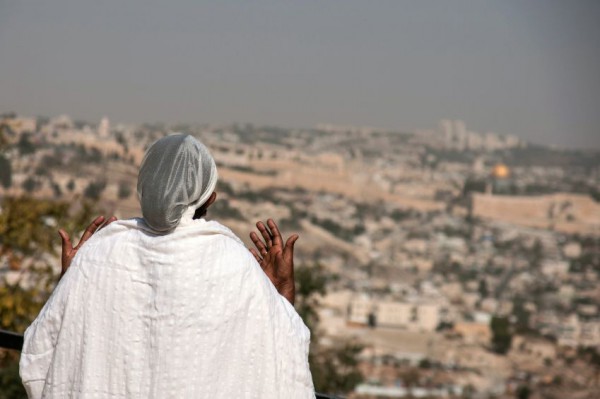 Ethiopian woman prays toward the Temple Mount in Jerusalem King Solomon's prayer-Temple Mount-Sigd-holyday-Ethiopian-Jews