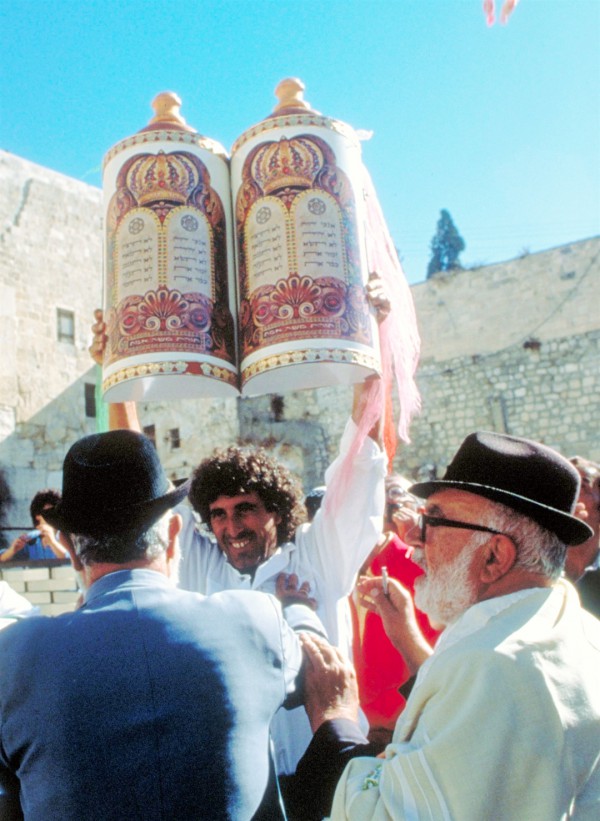 Lifting the Torah for all to see at the Western (Wailing) Wall in the Old City of Jerusalem. (Photo: Israel Ministry of Tourism) Lifting the Torah for all to see at the Western (Wailing) Wall in the Old City of Jerusalem. (Photo: Israel Ministry of Tourism)