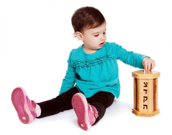 In Judaism, giving to the poor is the performance of a duty Toddler-Charity-Tzedakah box