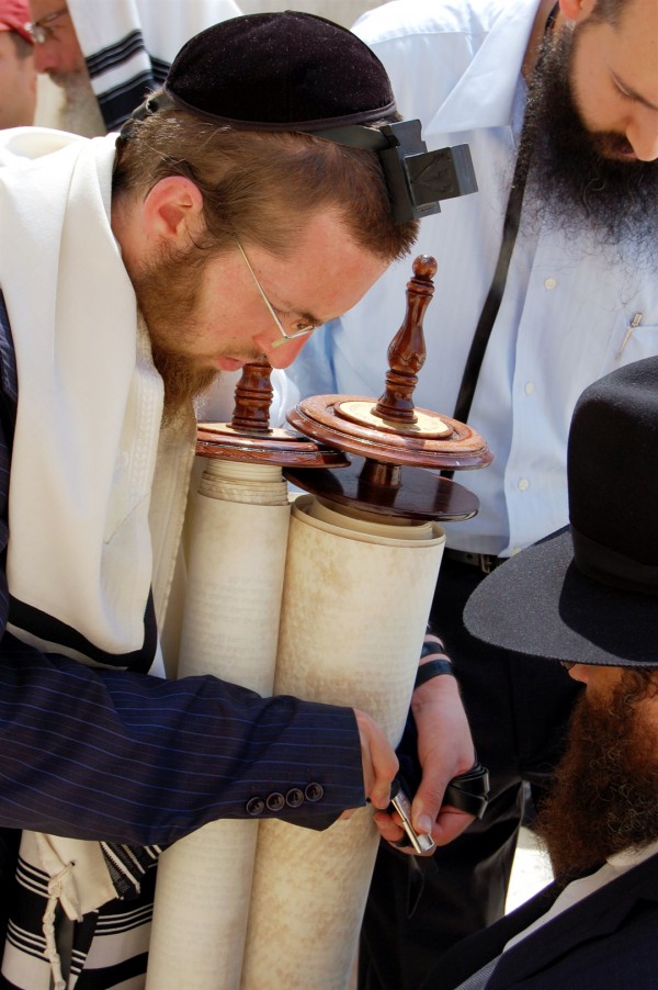 The sash is secured around the Torah scroll before it is placed in the ark. Torah, Ark, Mantle, Sash
