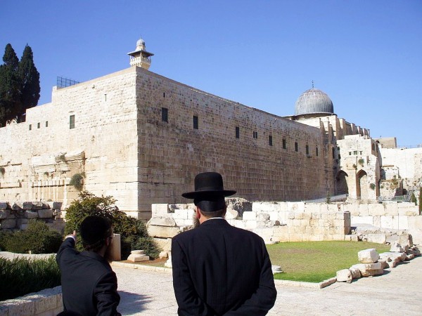 An Orthodox Jewish man points to the remains of Robinson's Arch, a monumental staircase built by Herod that was supported by an unusually wide stone arch. It stood at the southwestern corner of the Temple Mount. An Orthodox Jewish man points to the remains of Robinson's Arch, a monumental staircase built by Herod that was supported by an unusually wide stone arch. It stood at the southwestern corner of the Temple Mount.