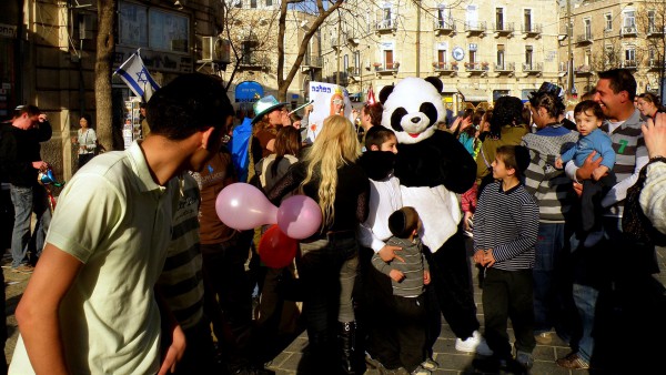 Purim is a joyous festival of costumes, parades and parties. In the above photo, Israelis celebrate Purim in the streets in Jerusalem. (Photo by Ron Almog) Purim is a joyous festival of costumes, parades and parties. In the above photo, Israelis celebrate Purim in the streets in Jerusalem. (Photo by Ron Almog)