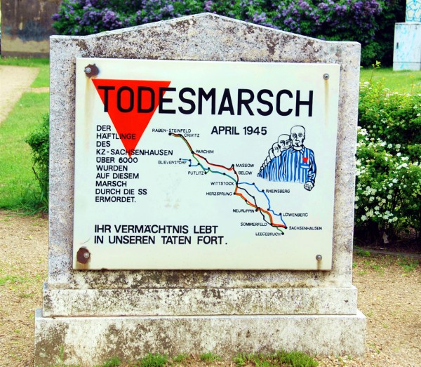 This Holocaust memorial, erected by the Communist German Democratic Republic (GDR) government, remembers the forced Death Marches of the Sachsenhausen concentration camp prisoners under the Nazi government. Because the GDR emphasized political prisoners over the other groups held at Sachsenhausen (Jews, Jehovah's Witnesses, homosexuals), the pictured prisoners are wearing red triangles (the symbol for political prisoners, particularly communists). This Holocaust memorial, erected by the Communist German Democratic Republic (GDR) government, remembers the forced Death Marches of the Sachsenhausen concentration camp prisoners under the Nazi government. Because the GDR emphasized political prisoners over the other groups held at Sachsenhausen (Jews, Jehovah's Witnesses, homosexuals), the pictured prisoners are wearing red triangles (the symbol for political prisoners, particularly communists).