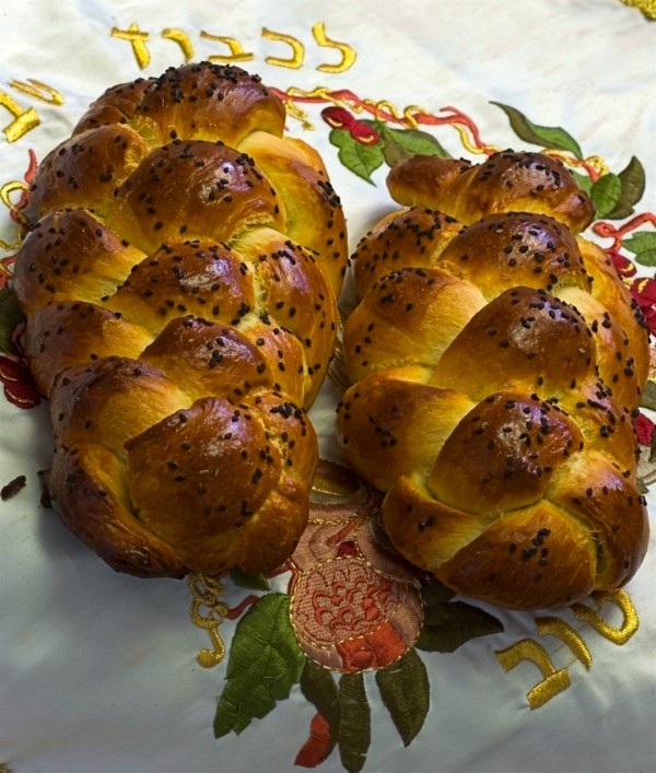 two challah "Bring two loaves made of two-tenths of an ephah of the finest flour, baked with yeast, as a wave offering of firstfruits to the Lord." (Leviticus 23:17)