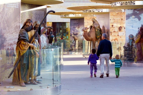 A father brings his children through the Bible City exhibits at Cinema City in Jerusalem. Within this particular set of exhibits are 62 stories from the Bible, including the creation of the world, the binding of Isaac, Jacob’s ladder, and the biggest Noah's Ark exhibit of its kind in the world. A father brings his children through the Bible City exhibits at Cinema City in Jerusalem. Within this particular set of exhibits are 62 stories from the Bible, including the creation of the world, the binding of Isaac, Jacob’s ladder, and the biggest Noah's Ark exhibit of its kind in the world.
